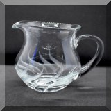 G26. Swirl cut glass creamer. 4”h  